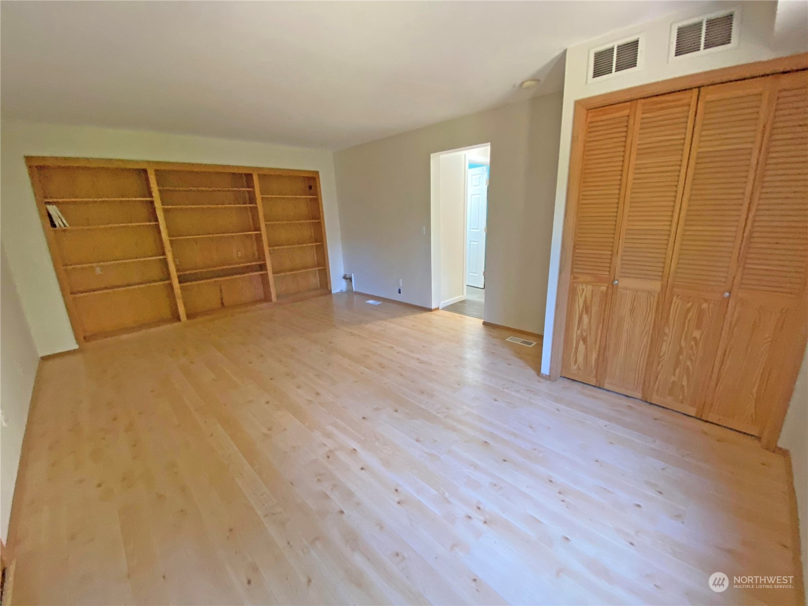 1804 224th Street Southwest Bothell, WA 98021 - Photo 16 of 31 an empty room with wooden floor and cabinet