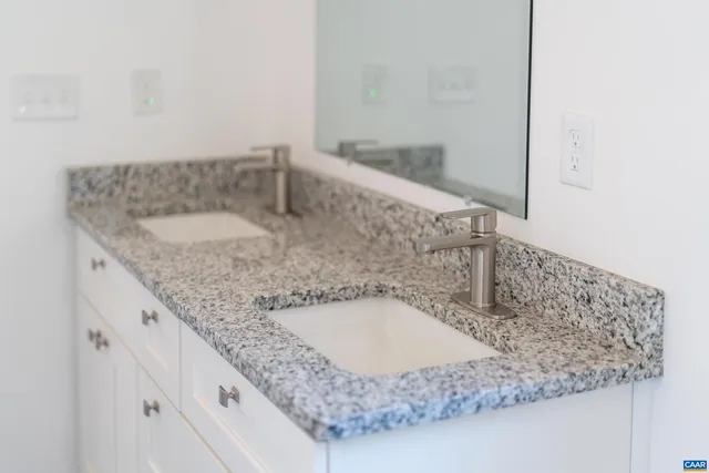 a view of a room with wooden floor a ceiling fan and a window