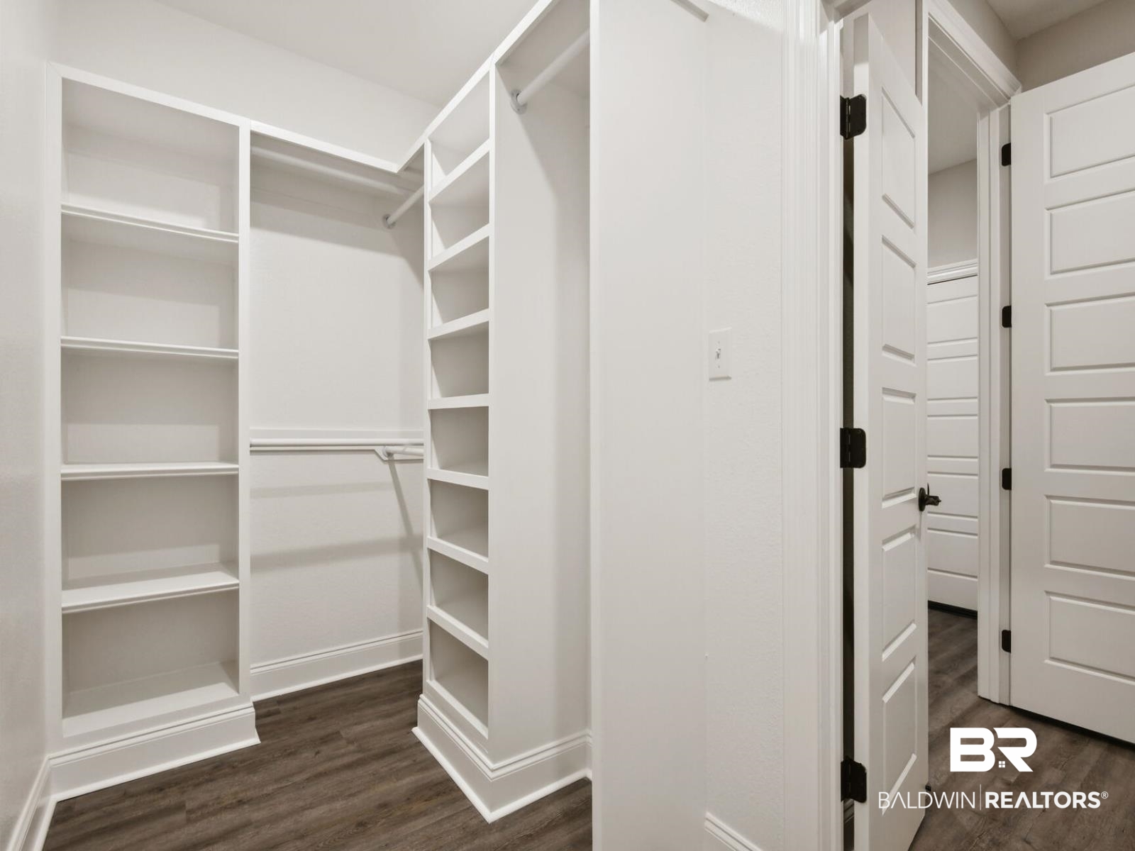 12942 Gondala Street Elberta, AL 36530 - Photo 12 of 18 Spacious closet featuring dark wood finished floors