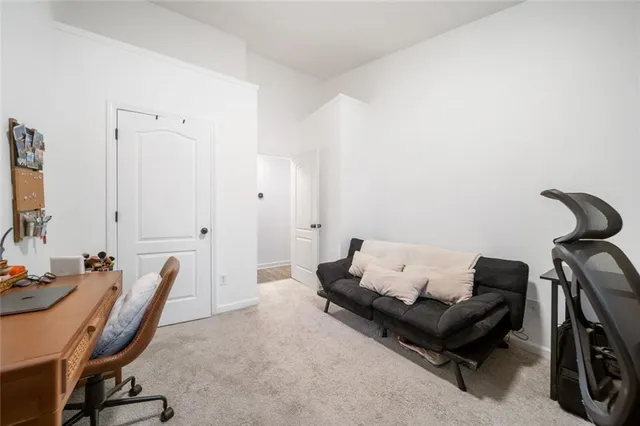 a bedroom with a bed and chair