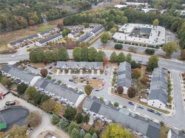 an aerial view of residential houses with city view