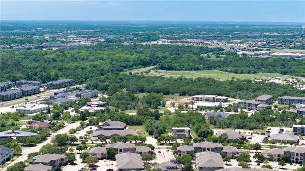 a view of a city with a lake