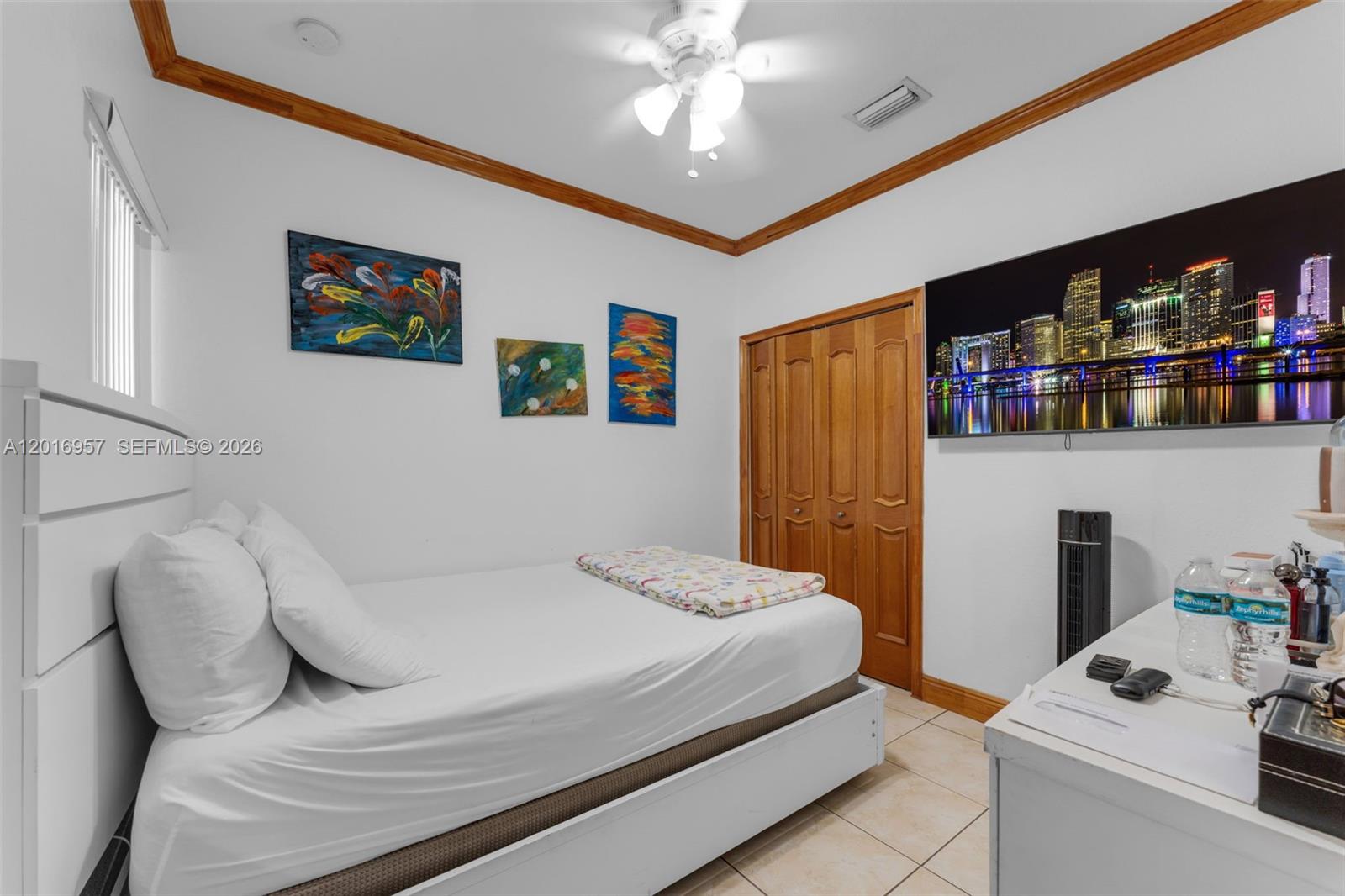 12266 Southwest 215th Terrace Miami, FL 33177 - Photo 12 of 29 a bedroom with a bed and a bookshelf