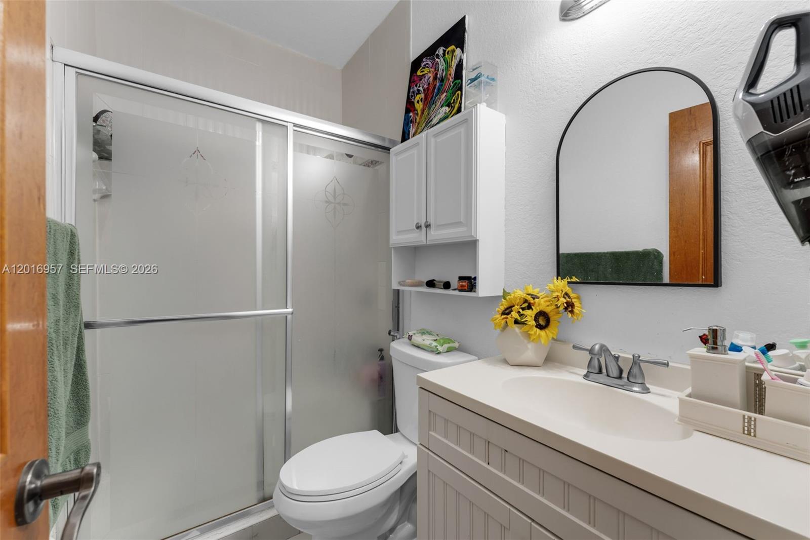 12266 Southwest 215th Terrace Miami, FL 33177 - Photo 13 of 29 a bathroom with a sink toilet and shower