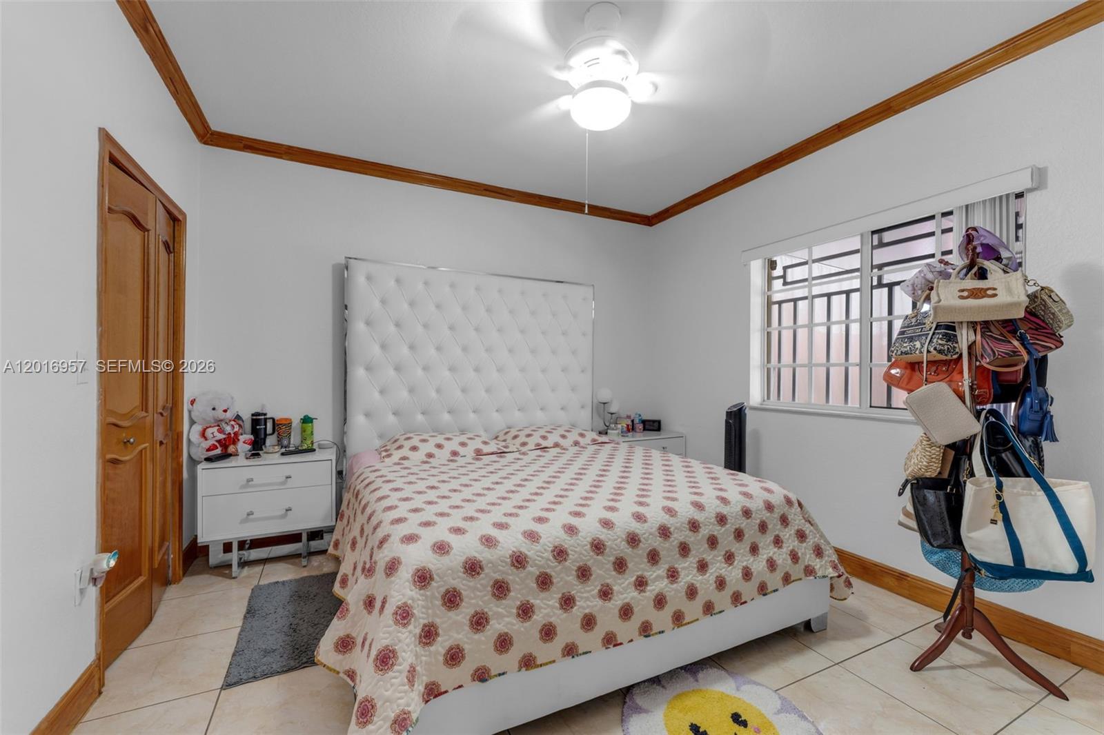 12266 Southwest 215th Terrace Miami, FL 33177 - Photo 15 of 29 a bedroom with a bed and wooden floor