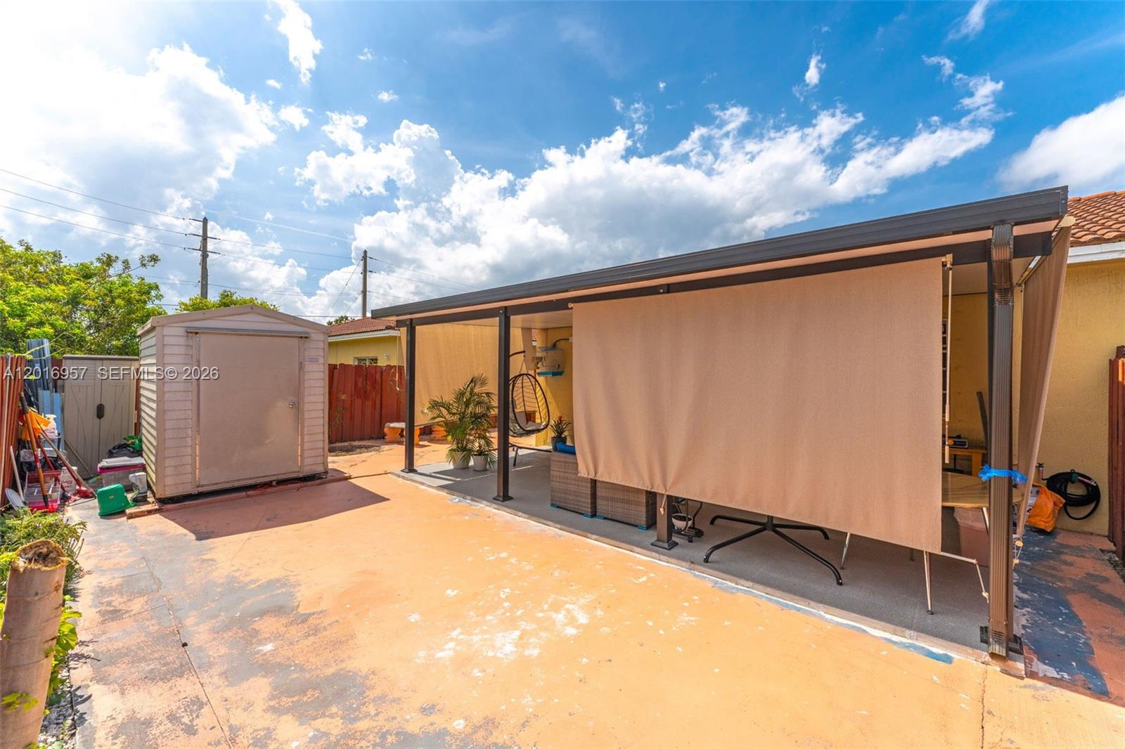 12266 Southwest 215th Terrace Miami, FL 33177 - Photo 22 of 29 a view of a backyard with patio