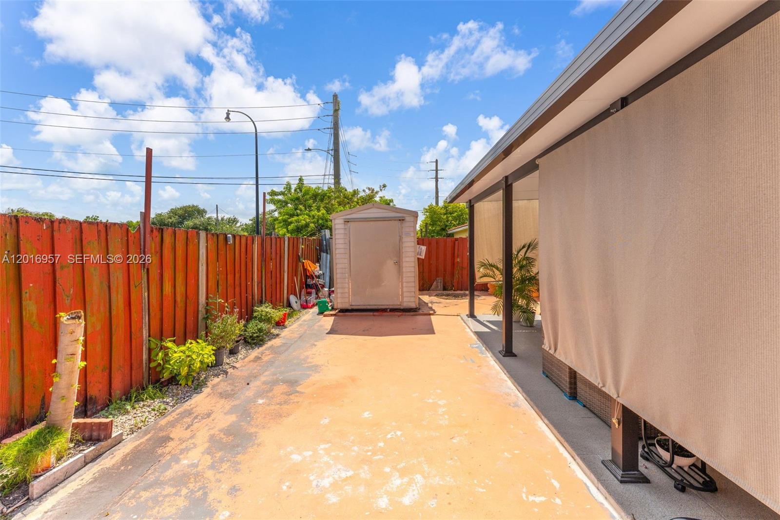 12266 Southwest 215th Terrace Miami, FL 33177 - Photo 23 of 29 a view of a pathway of a building from a balcony