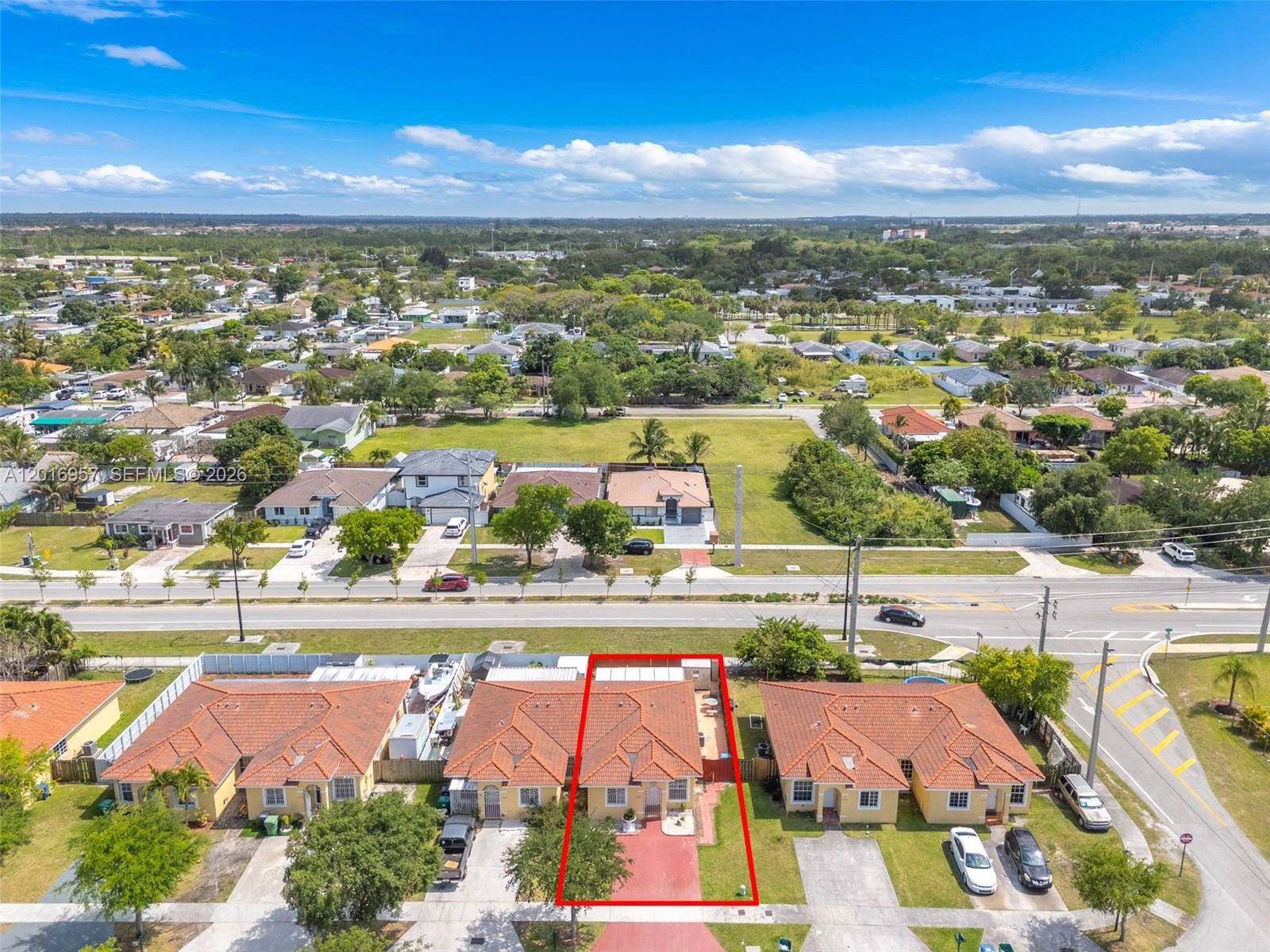 12266 Southwest 215th Terrace Miami, FL 33177 - Photo 24 of 29 an aerial view of residential houses with outdoor space