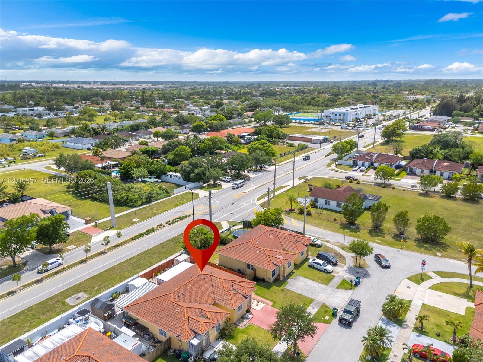 12266 Southwest 215th Terrace Miami, FL 33177 - Photo 25 of 29 an aerial view of residential houses with outdoor space