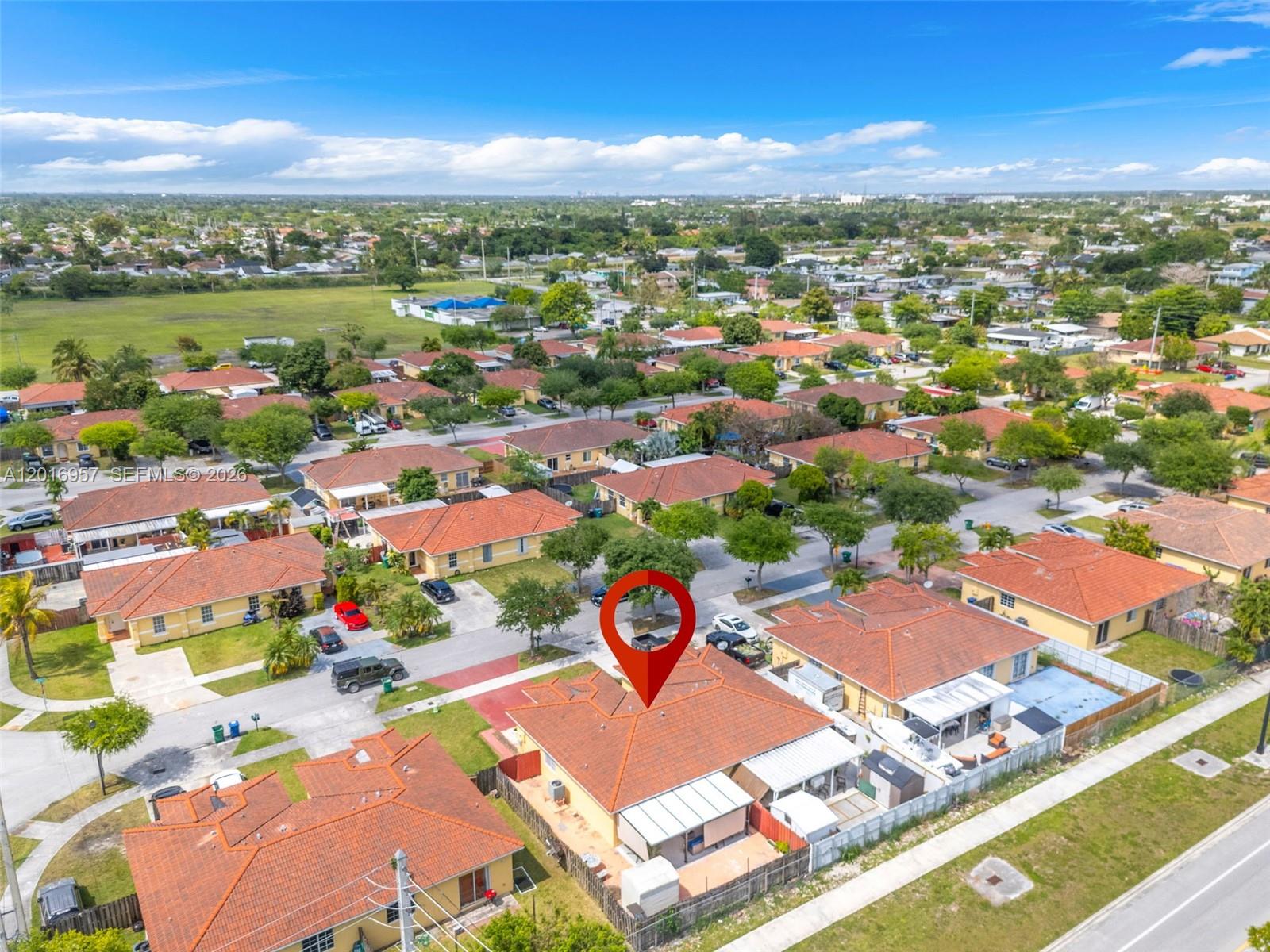 12266 Southwest 215th Terrace Miami, FL 33177 - Photo 27 of 29 an aerial view of residential houses with outdoor space