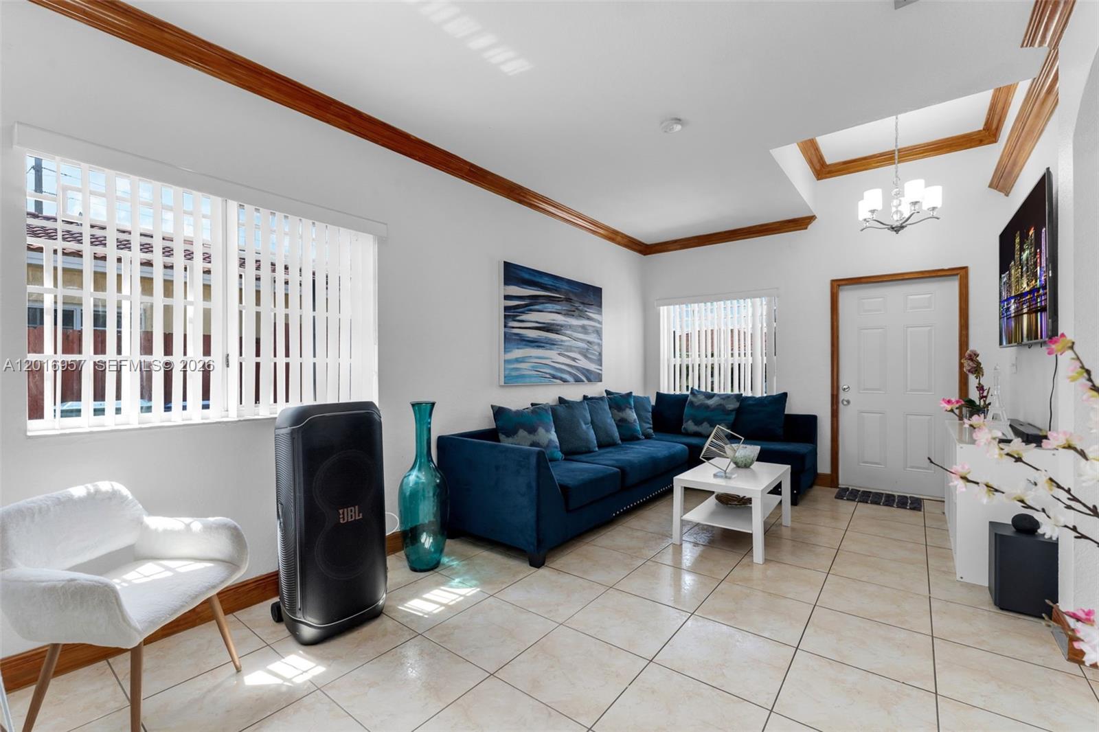 12266 Southwest 215th Terrace Miami, FL 33177 - Photo 4 of 29 a living room with furniture and a window