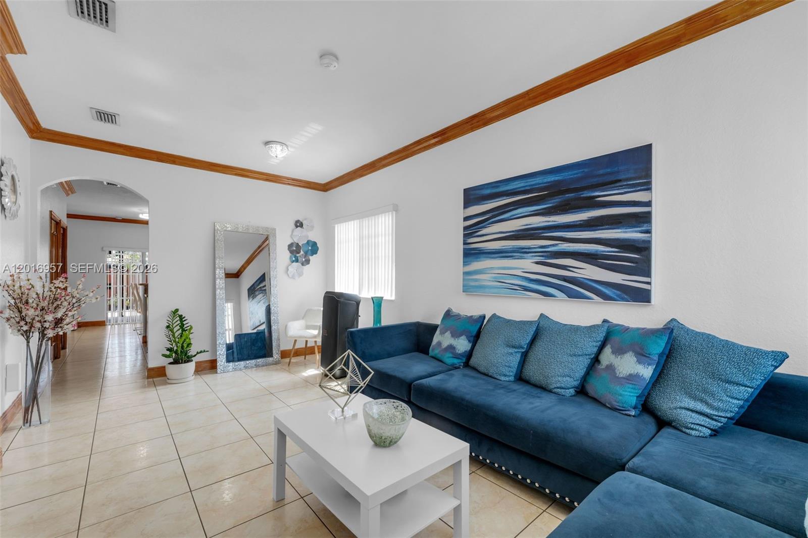 12266 Southwest 215th Terrace Miami, FL 33177 - Photo 5 of 29 a living room with furniture and wooden floor