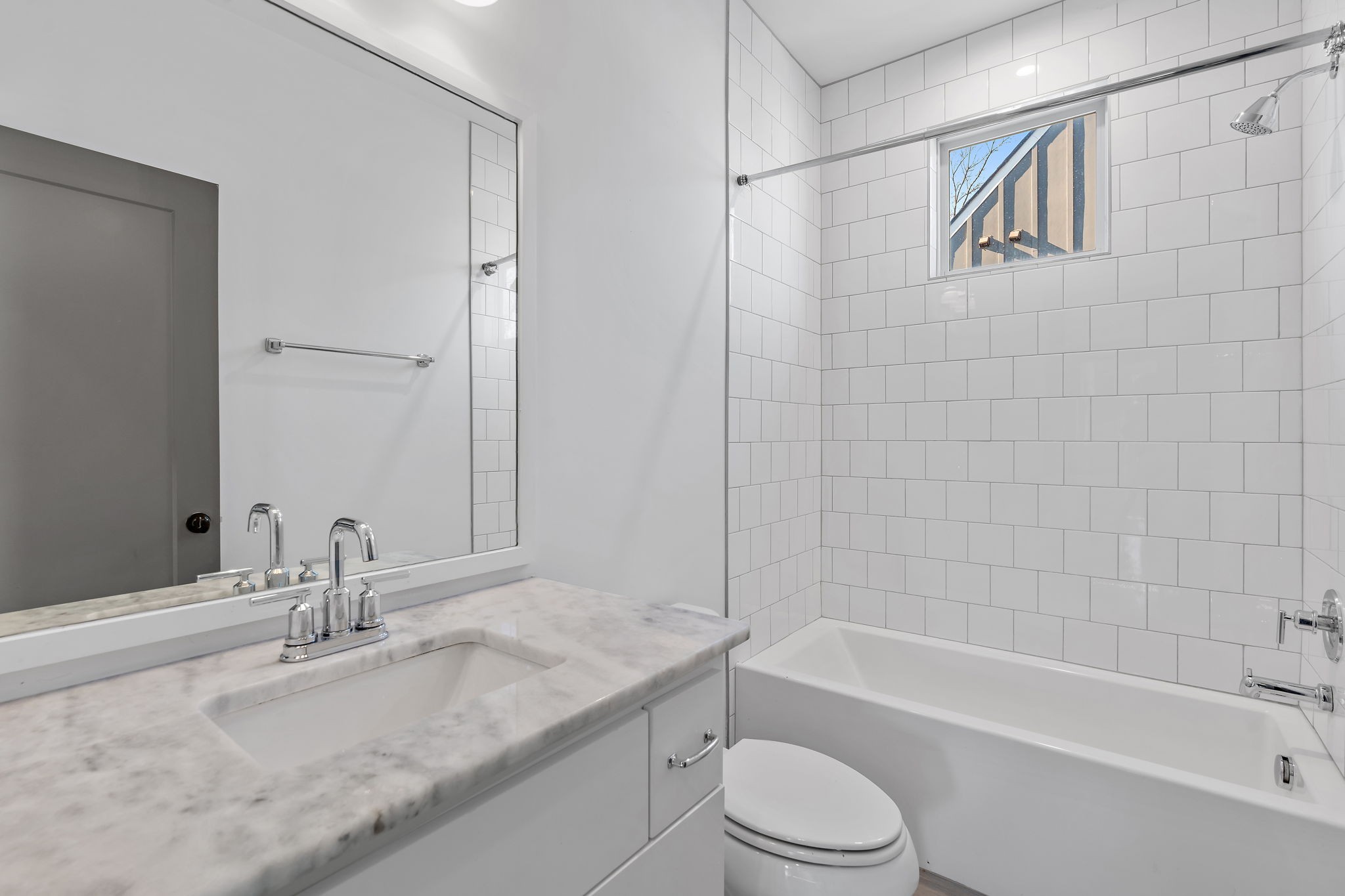 1925 10th Avenue North Nashville, TN 37208 - Photo 26 of 40 a bathroom with a granite countertop bathtub sink vanity mirror and toilet