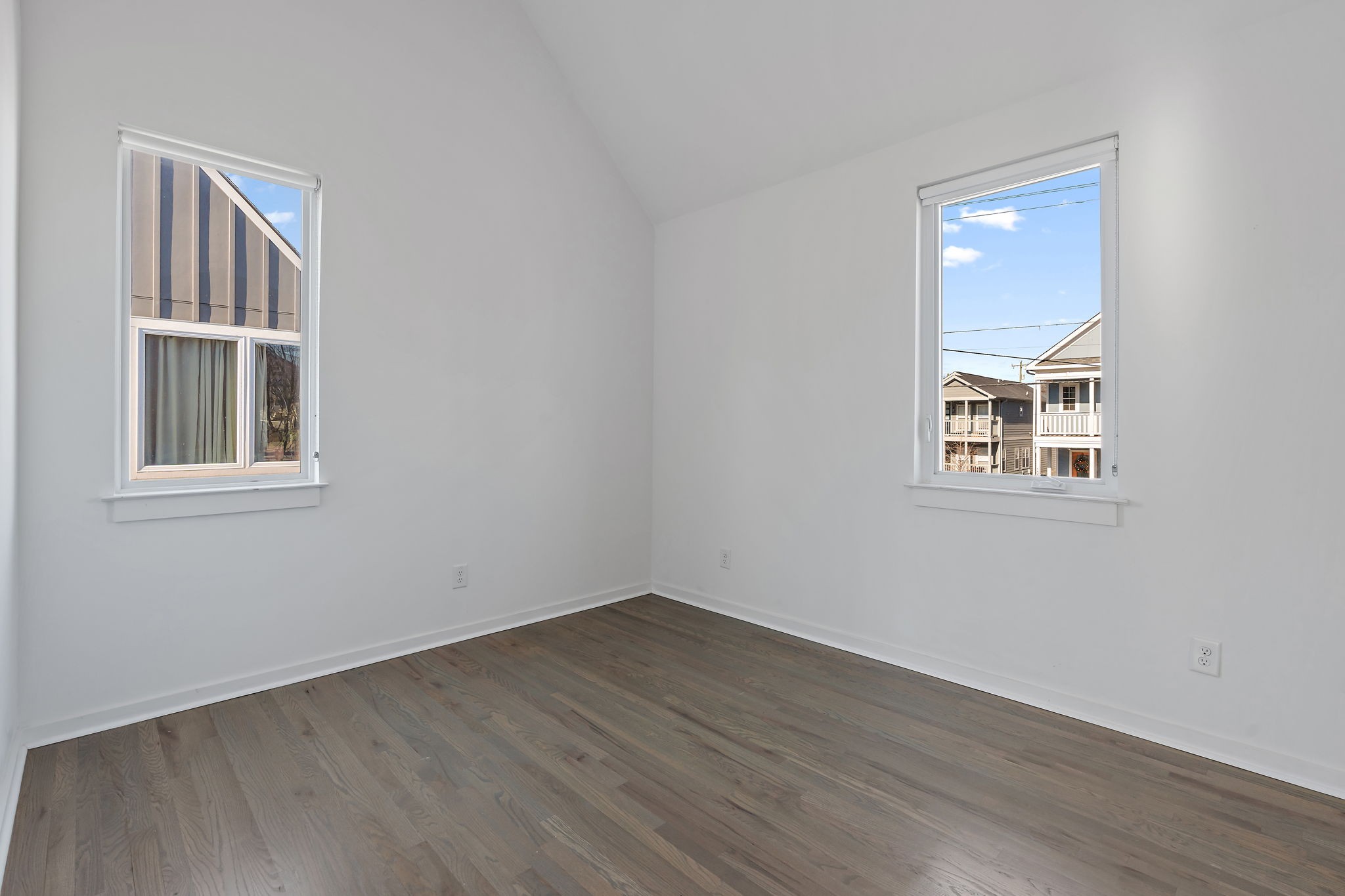 1925 10th Avenue North Nashville, TN 37208 - Photo 27 of 40 a view of an empty room with wooden floor and a window