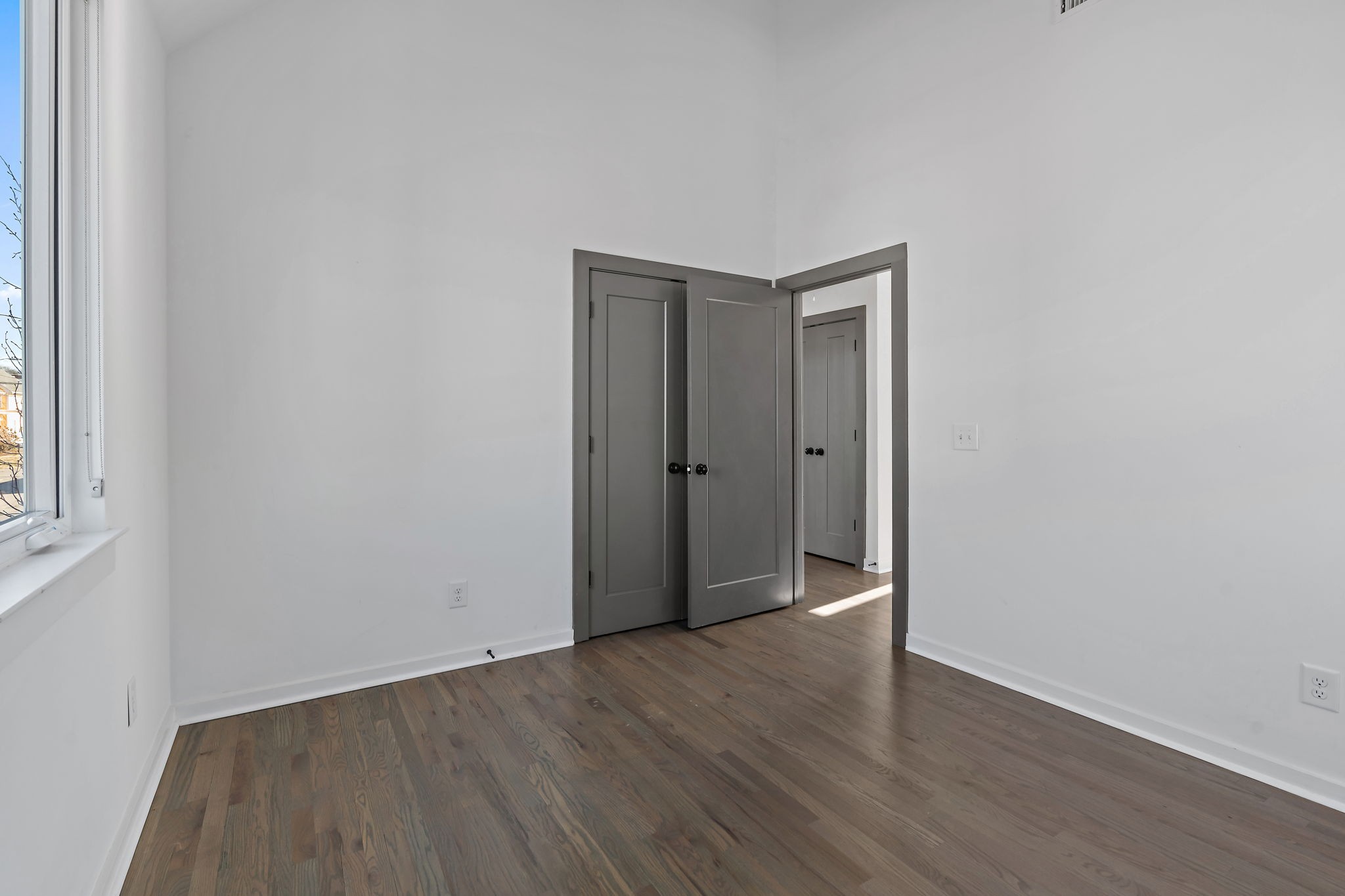 1925 10th Avenue North Nashville, TN 37208 - Photo 28 of 40 a view of an empty room with wooden floor