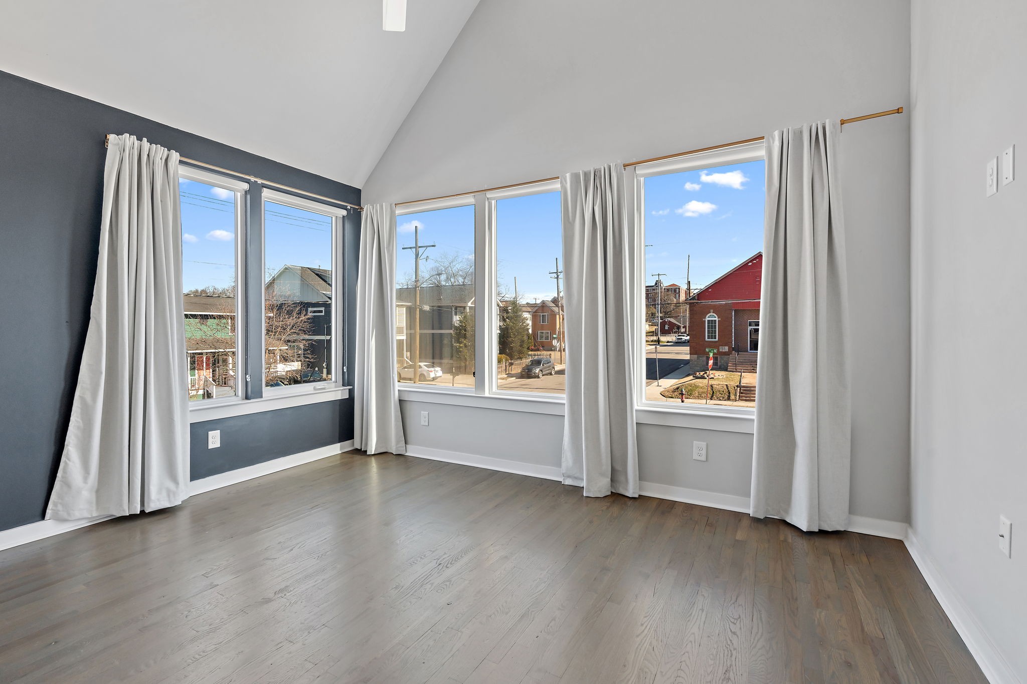 1925 10th Avenue North Nashville, TN 37208 - Photo 31 of 40 an empty room with wooden floor and windows