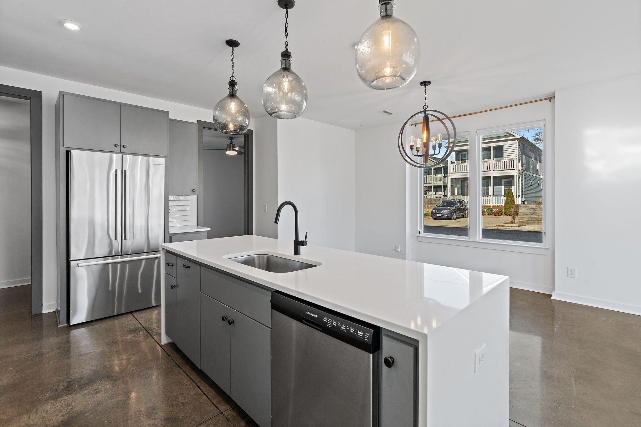 1925 10th Avenue North Nashville, TN 37208 - Photo 8 of 40 a kitchen with stainless steel appliances a sink and chandelier