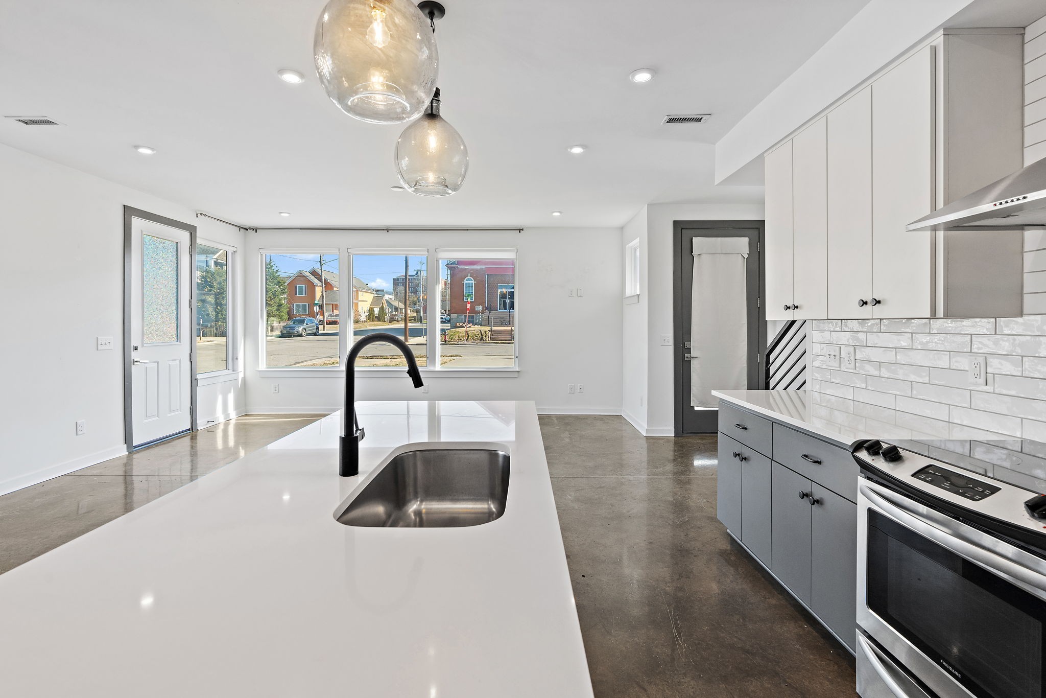 1925 10th Avenue North Nashville, TN 37208 - Photo 10 of 40 a kitchen with a sink and a stove top oven