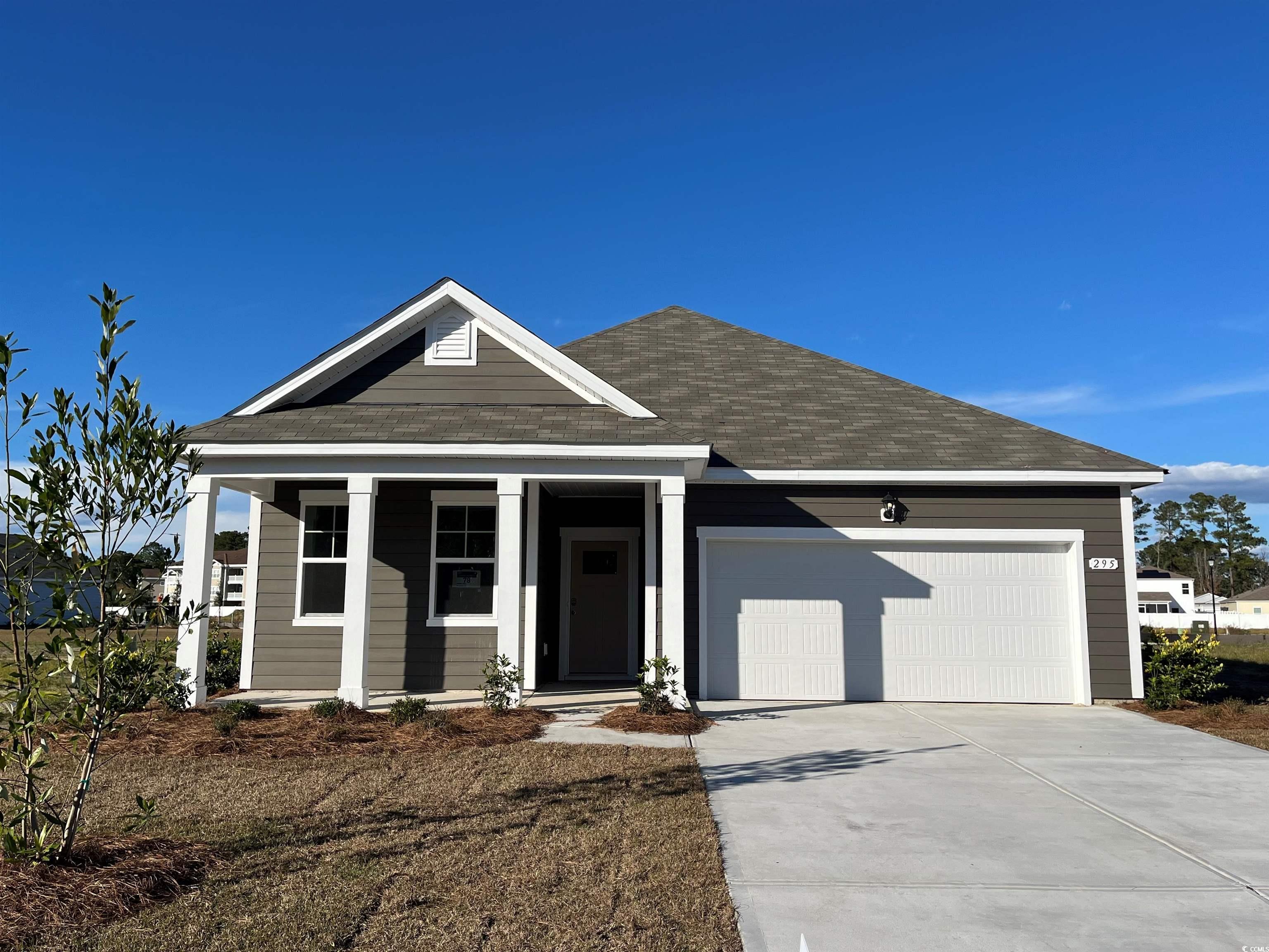 295 Ridley Street Longs, SC 29568 - Photo 1 of 12 View of front of home with a garage