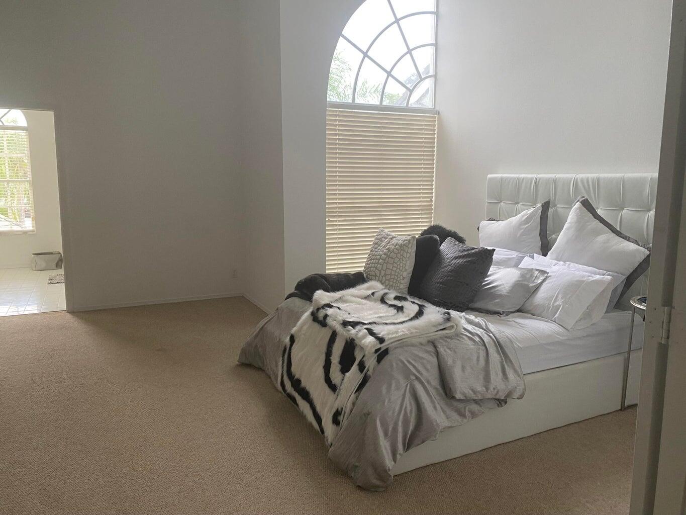 21530 St Andrews Grand Circle, Unit 27 Boca Raton, FL 33486 - Photo 11 of 17 a bedroom with a bed and a window