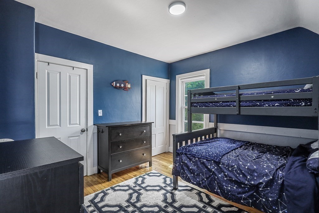 10 Worsted Street Franklin, MA 02038 - Photo 17 of 28 a bedroom with a bed and cabinets