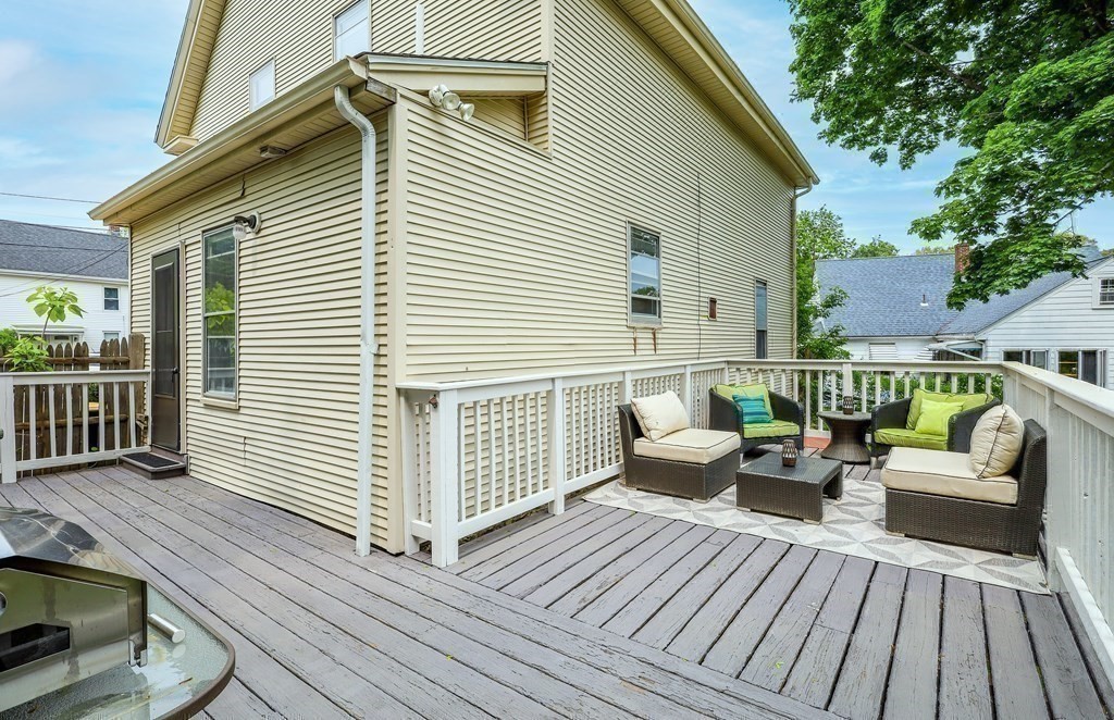 10 Worsted Street Franklin, MA 02038 - Photo 19 of 28 a view of a wooden deck with furniture