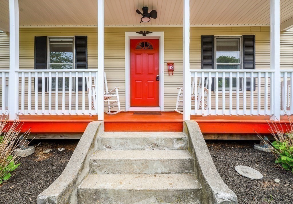 10 Worsted Street Franklin, MA 02038 - Photo 25 of 28 a backyard of a house with a barbeque grill and a floor to ceiling window