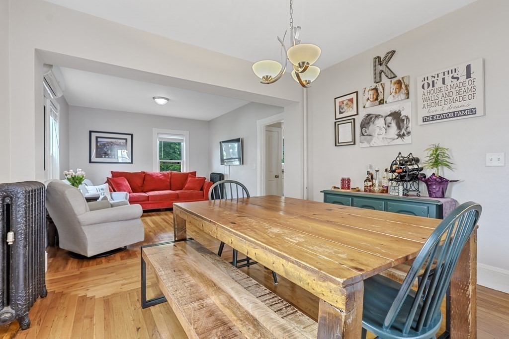 10 Worsted Street Franklin, MA 02038 - Photo 5 of 28 a living room with furniture dining table and a chandelier