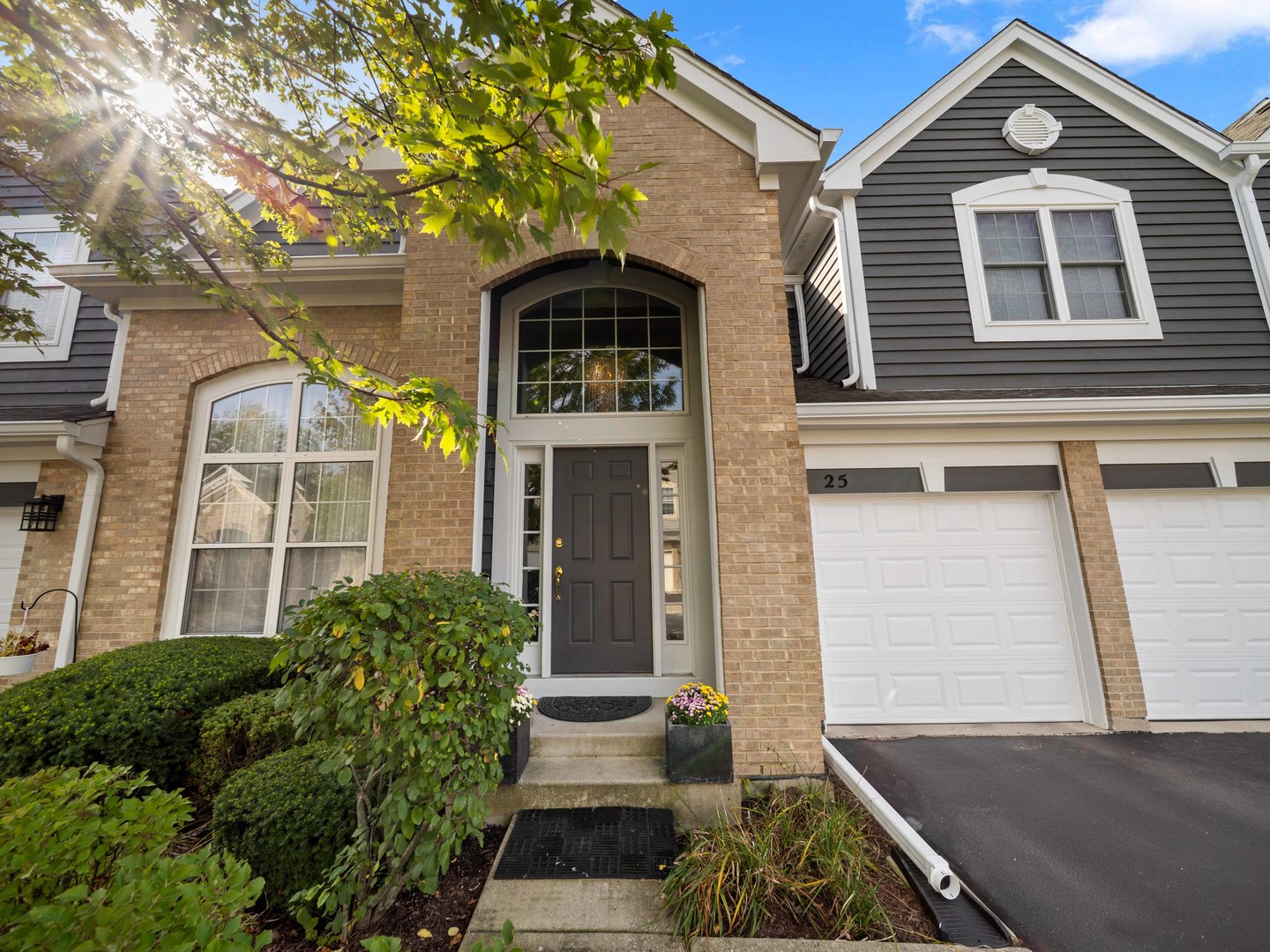 a front view of a house with garden