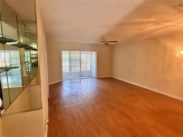 a view of a livingroom with wooden floor
