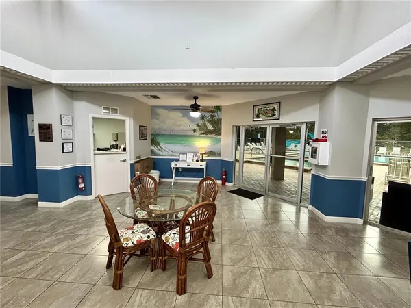 a view of a dining room with furniture and a livingroom