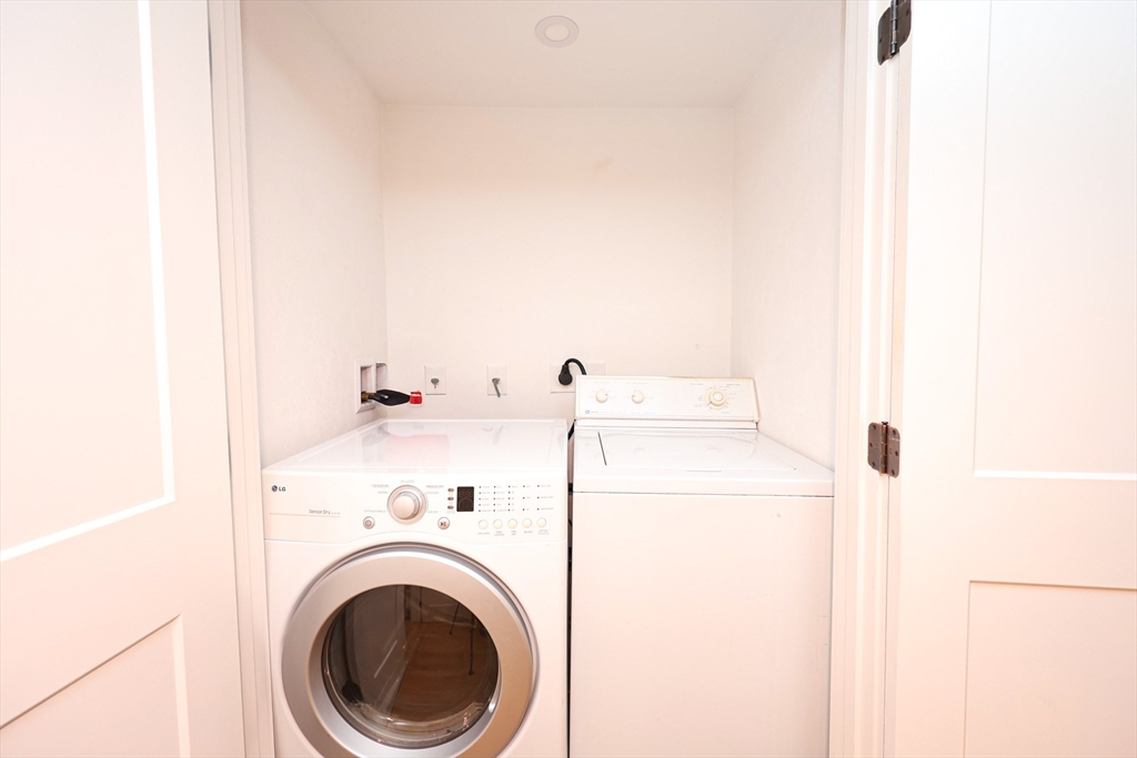 85 Oak Street, Unit 85 Randolph, MA 02368 - Photo 18 of 26 a utility room with dryer and washer