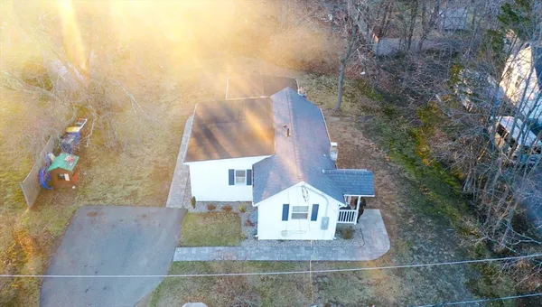 an aerial view of a house with swimming pool