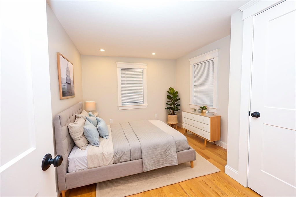 85 Oak Street, Unit 85 Randolph, MA 02368 - Photo 4 of 26 a bedroom with a bed and a window