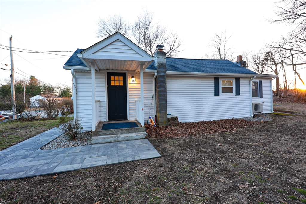 85 Oak Street, Unit 85 Randolph, MA 02368 - Photo 6 of 26 a front view of a house with garden