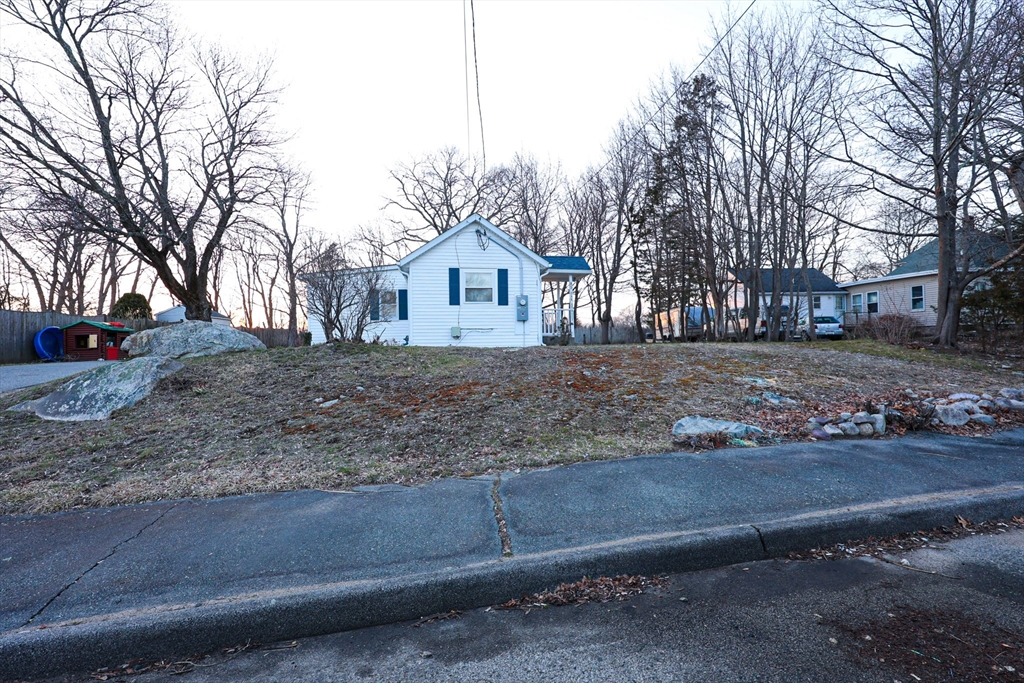 85 Oak Street, Unit 85 Randolph, MA 02368 - Photo 8 of 26 a front view of a house with a yard