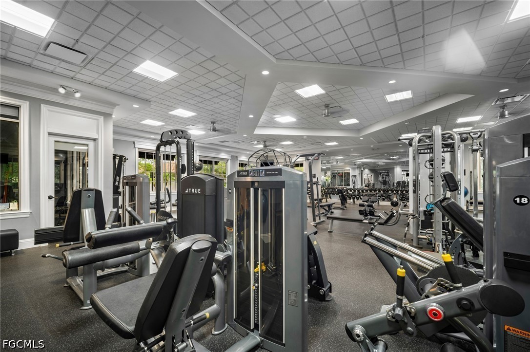 9042 Bronco Court Naples, FL 34113 - Photo 45 of 50 a view of a room with gym equipment