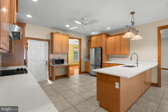 a kitchen with stainless steel appliances granite countertop a stove a sink and dishwasher
