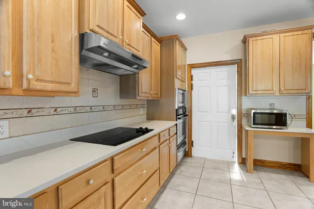 a large kitchen with a large window