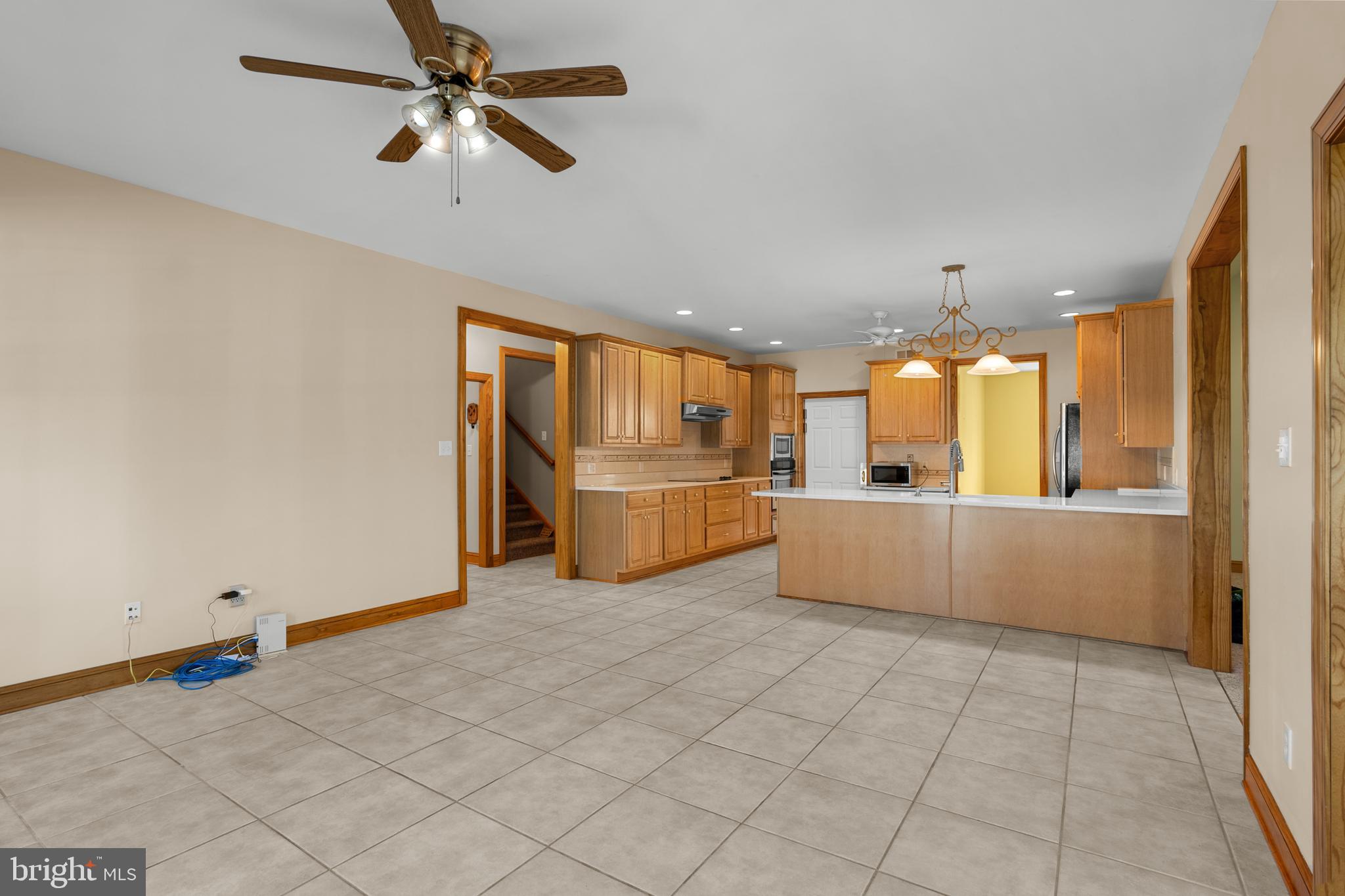 1211 Dexter Corner Road Townsend, DE 19734 - Photo 25 of 66 a view of a kitchen with furniture and an empty room