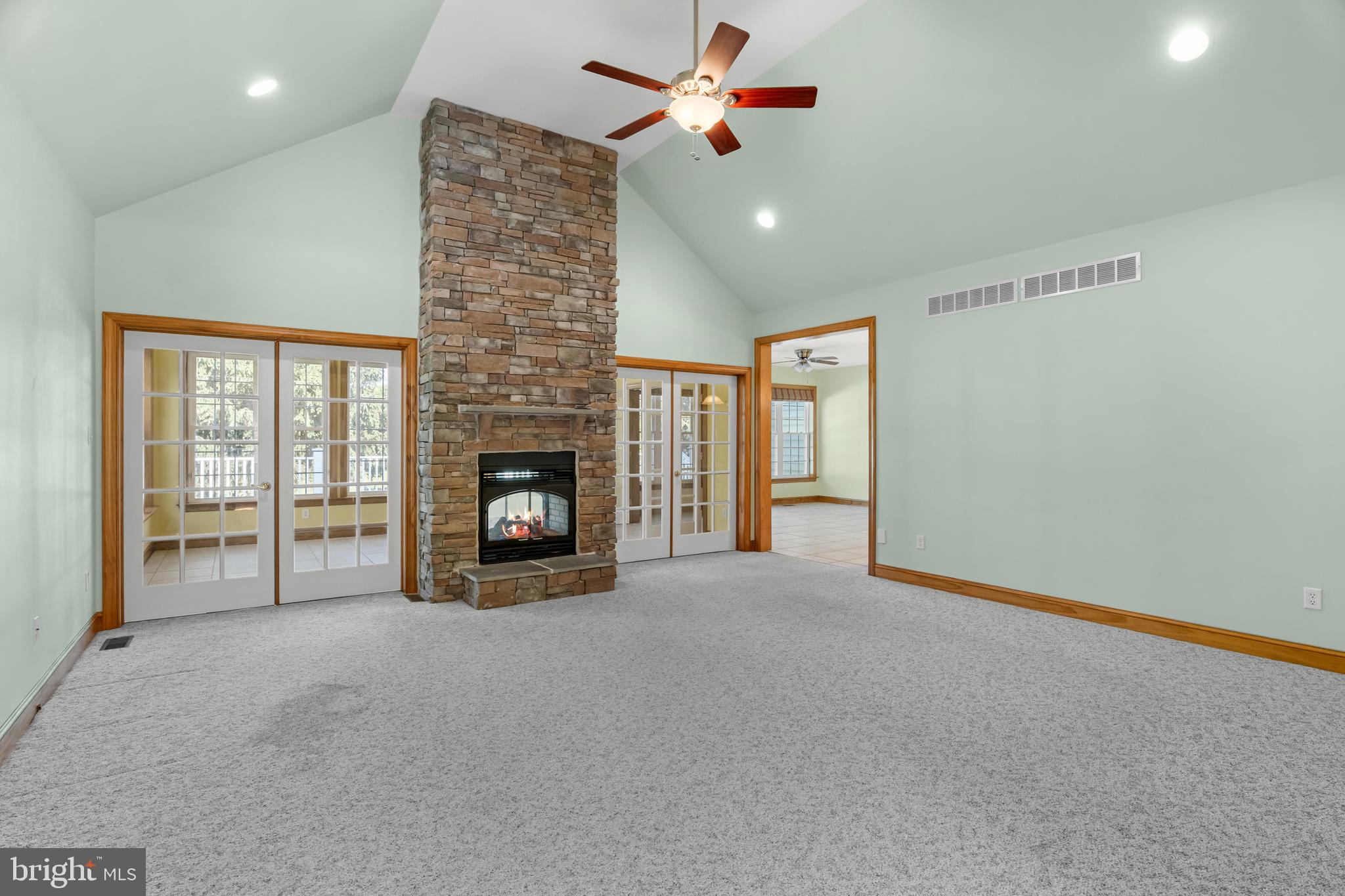 1211 Dexter Corner Road Townsend, DE 19734 - Photo 30 of 66 a big room with windows and a fireplace