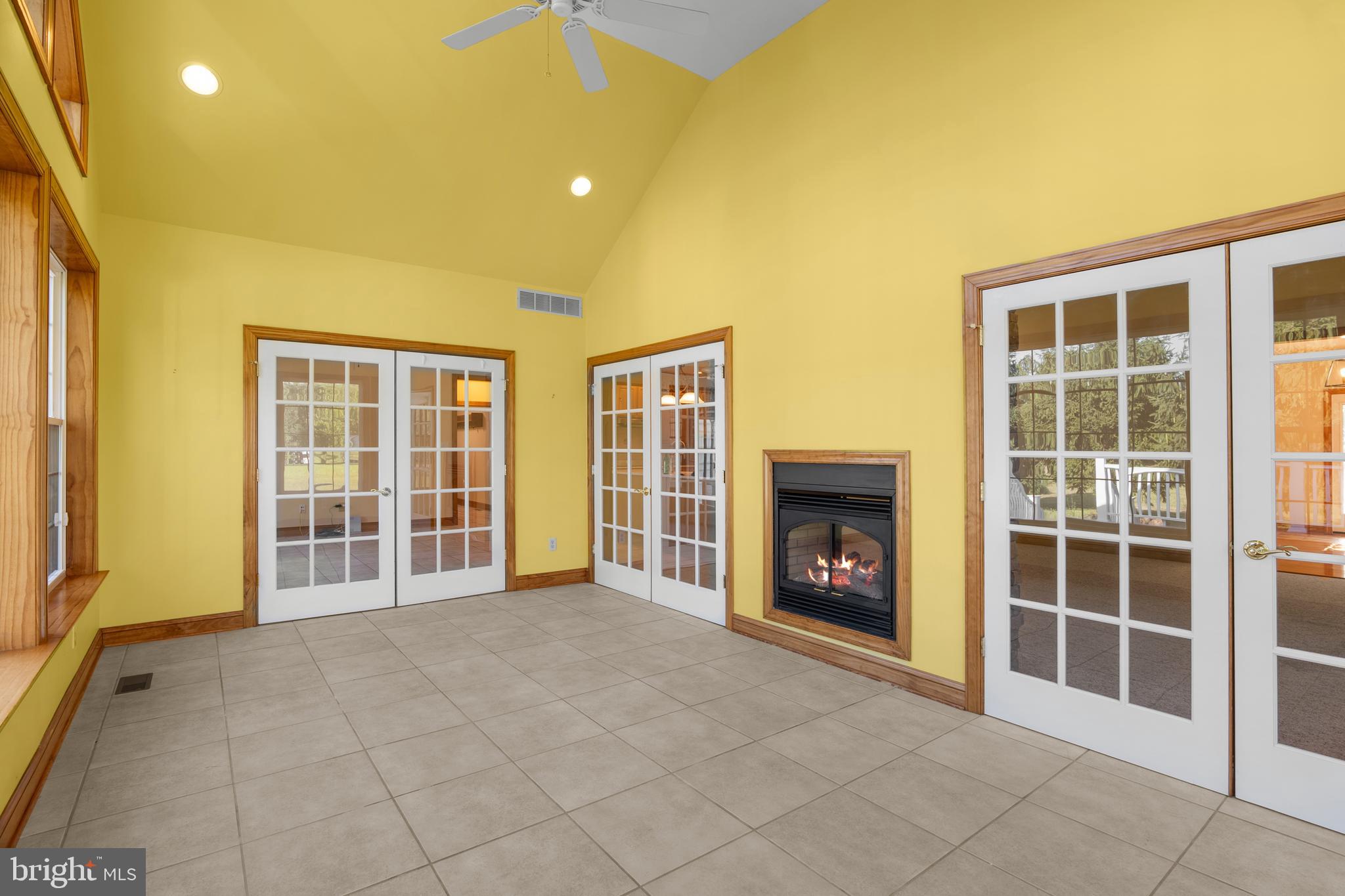 1211 Dexter Corner Road Townsend, DE 19734 - Photo 35 of 66 a view of an empty room with a fireplace and a window