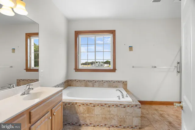 a bathroom with a sink a toilet and a bathtub