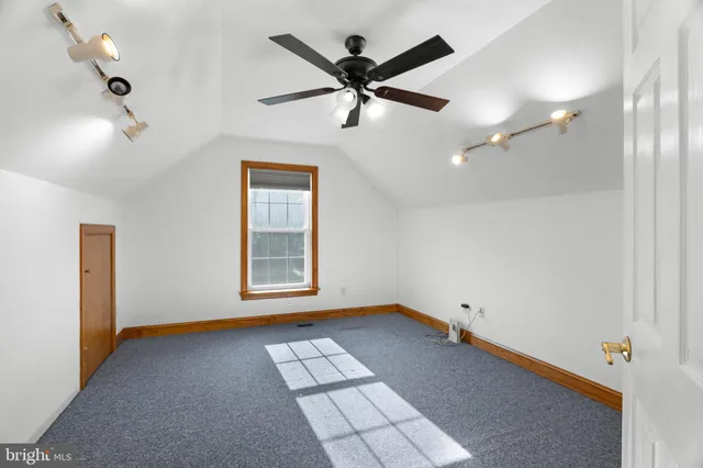 an aerial view of a houses with a lake