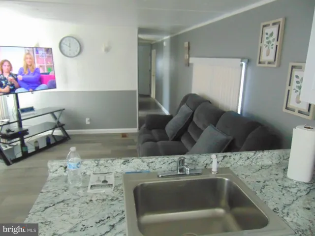 a kitchen with a sink and a couch