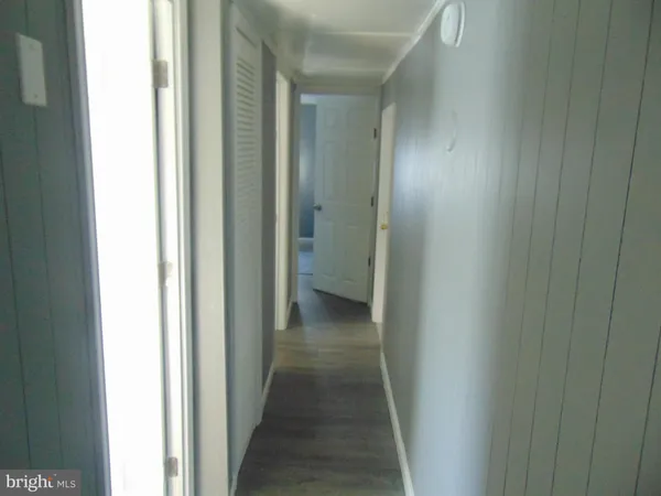 a view of a bathroom from a hallway