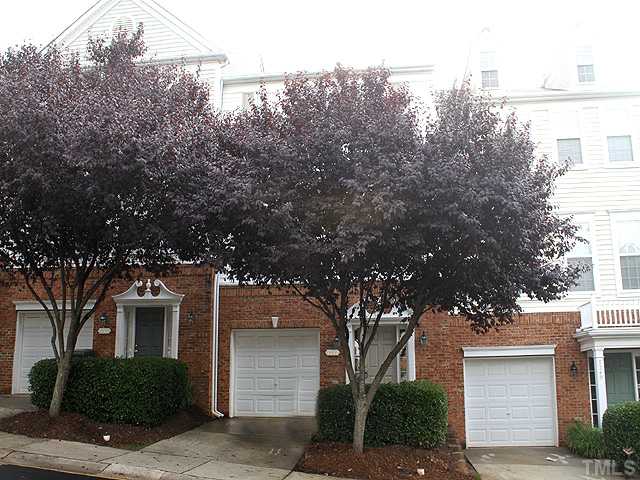 7242 Galon Glen Road Raleigh, NC 27613 - Photo 1 of 17 a front view of a house with trees and plants
