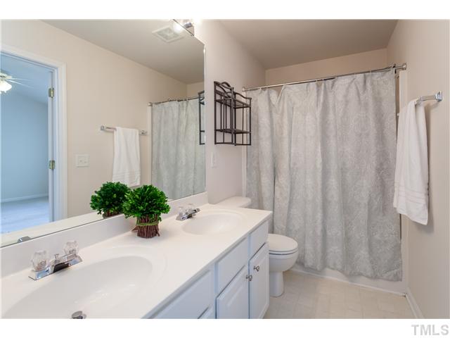 7242 Galon Glen Road Raleigh, NC 27613 - Photo 11 of 17 a bathroom with a sink toilet and shower