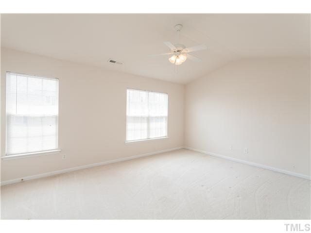 7242 Galon Glen Road Raleigh, NC 27613 - Photo 13 of 17 a view of an empty room with a window