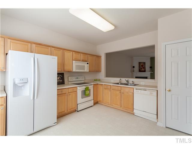 7242 Galon Glen Road Raleigh, NC 27613 - Photo 8 of 17 a kitchen with a refrigerator a sink and dishwasher